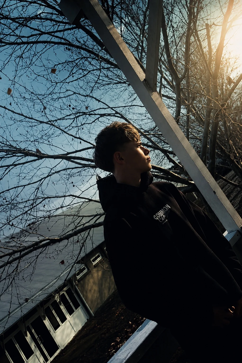 Jakob Corse-Scott outdoors in a black hoodie